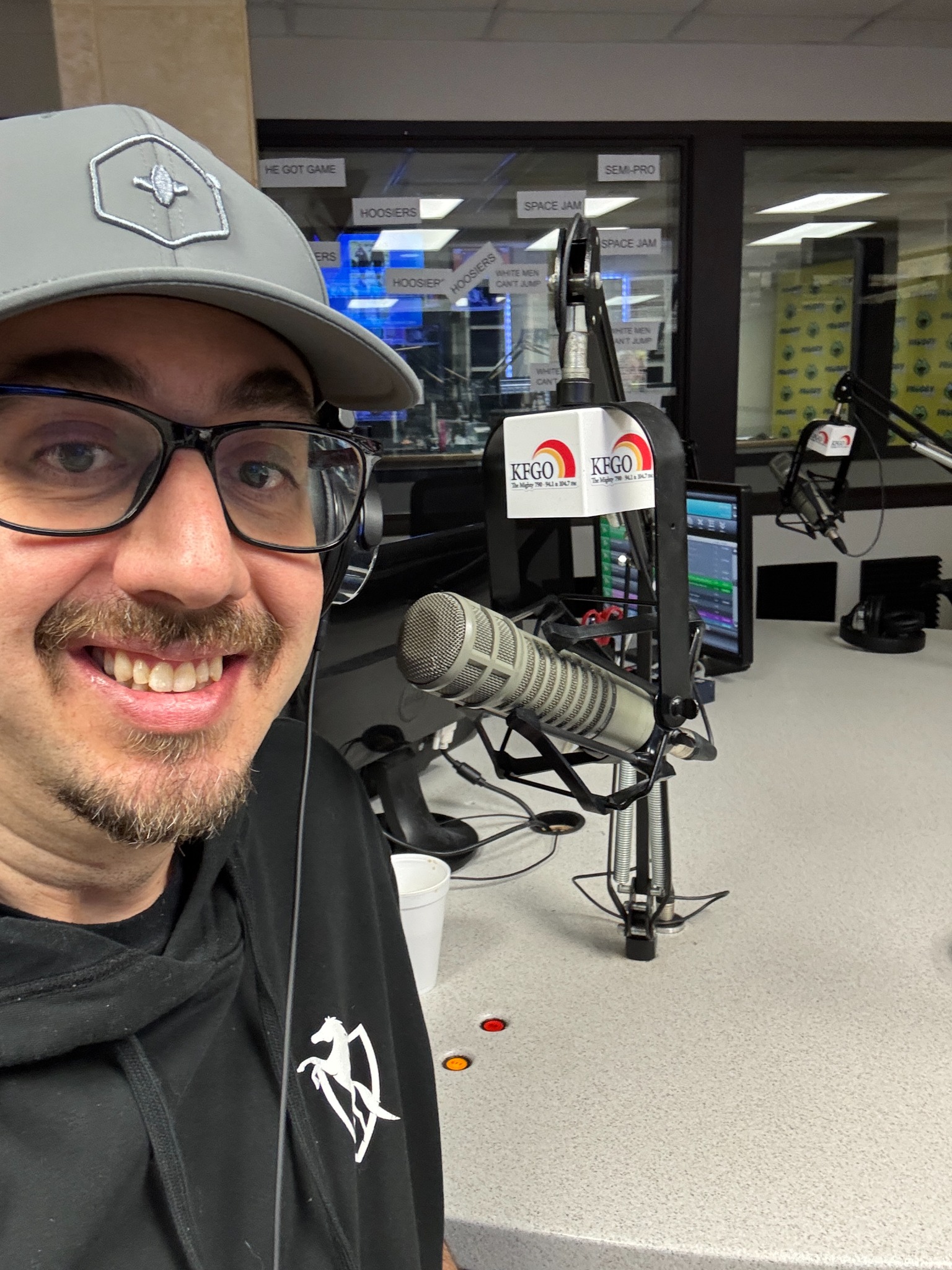 Jeff Carney at the KFGO studio microphone in Fargo